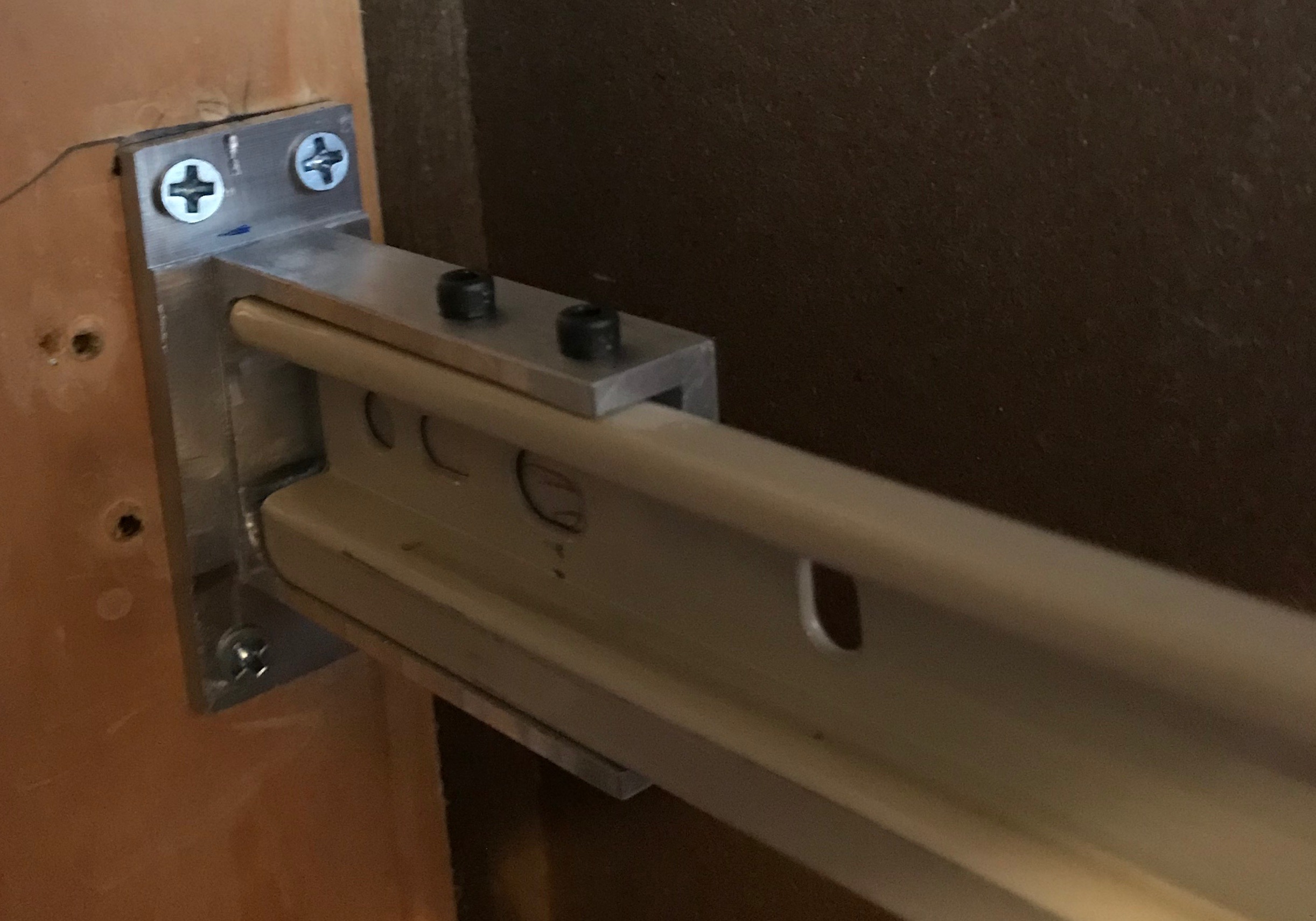 Drawer bracket installed in cabinet